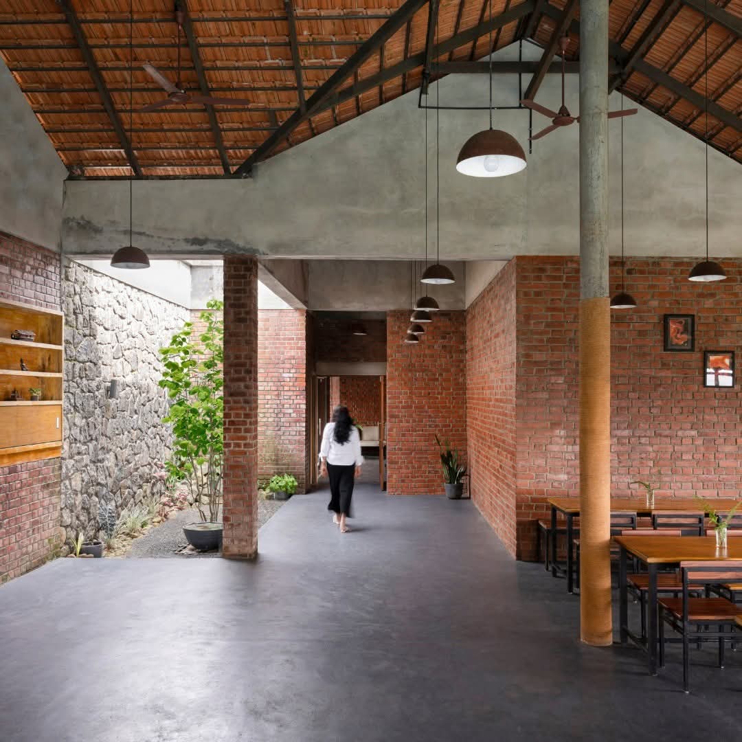 Brick-and-stone common dining room with a tiled roof at Heyday Thazhvaram, Panchalimedu, Idukki, Kerala