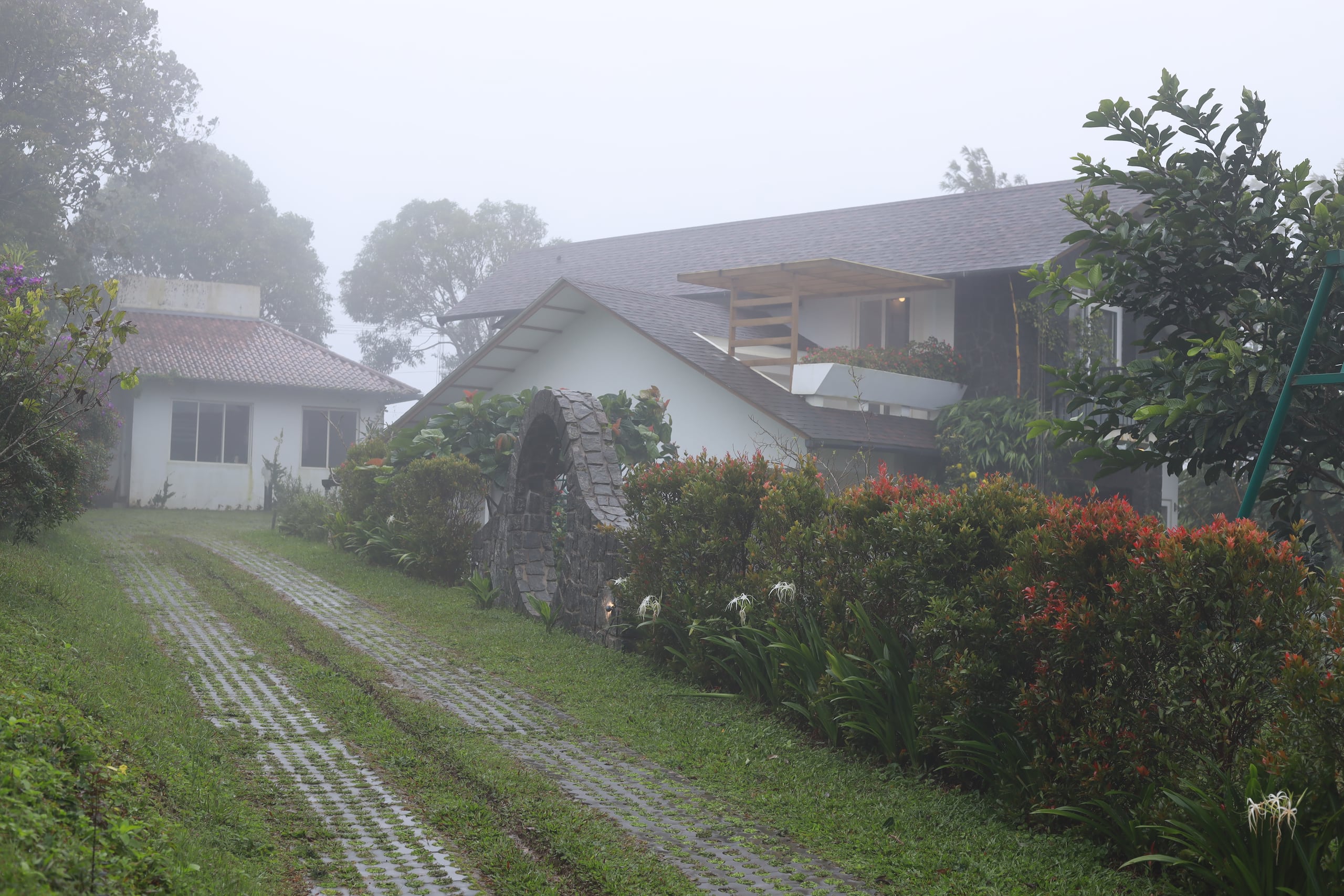 The hillside pool villa in the morning mist at Heyday Vagamon, Vagamon, Idukki, Kerala